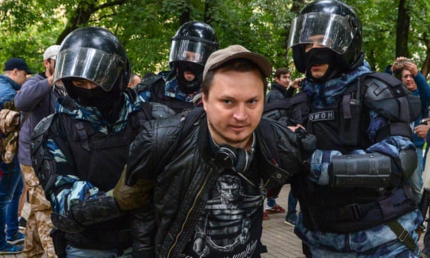Russian National Guard servicemen detaining a man after a rally in Moscow calling for fair elections on 10 August.