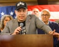 Anthony Constantino speaks into a microphone at a podium, delivering his primary victory speech