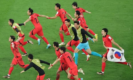 South Korea players share their joy after late victory against Portugal helps them qualify from Group H