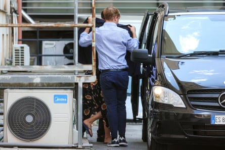 Members of a family that survived the Bayesian shipwreck leaving a paediatric hospital in Palermo