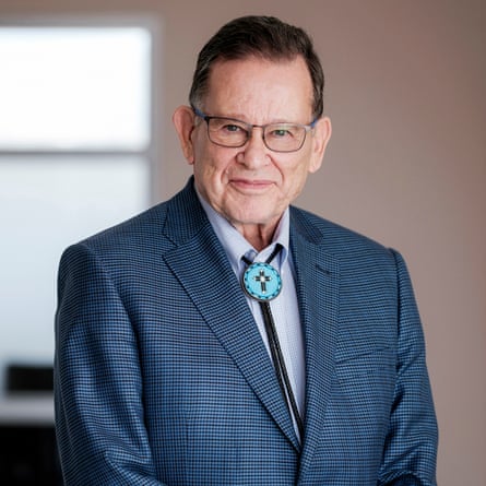 a man in a suit smiles for an image