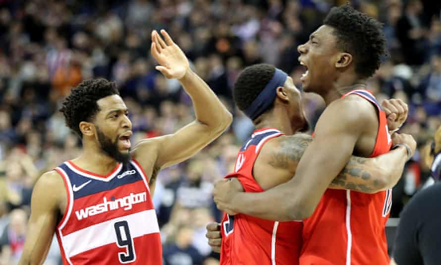 Washington Wizards' Thomas Bryant (right) celebrates with team-mates Bradley Beal (centre) and Chasson Randle at the end of the game in London.