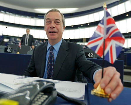 Farage placing a union flag on his desk
