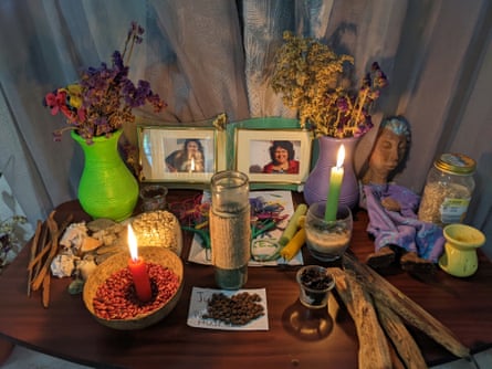An altar with candles and flowers dedicated to murdered Honduran environmentalist Berta Cáceres