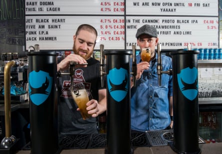 Martin Dickie and James Watt (right) photographed beneath a bar beer menu in 2016.