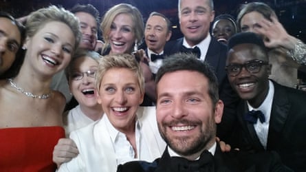 Oscars host Ellen DeGeneres poses for a selfie taken by Bradley Cooper with (clockwise from L-R) Jared Leto, Jennifer Lawrence, Channing Tatum, Meryl Streep, Julia Roberts, Kevin Spacey, Brad Pitt, Lupita Nyong’o, Angelina Jolie, Peter Nyong’o Jr. and Bradley Cooper during the 86th Annual Academy Awards at the Dolby Theatre on March 2 2014 in Hollywood, California