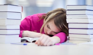 Female student slumped at desk.