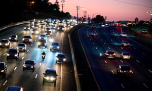 Motor vehicles drive on the 101 freeway in Los Angeles, California , US