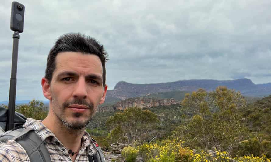 David Fanner walks through the Grampians National Park with a 360º camera sticking out of his backpack