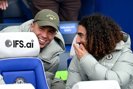 Enzo Fernandez and Marc Cucurella of Chelsea interact on the bench