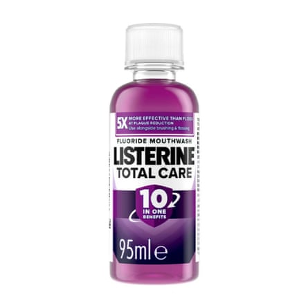 A small bottle of Listerine Total Care mouthwash. The mouthwash is purple.