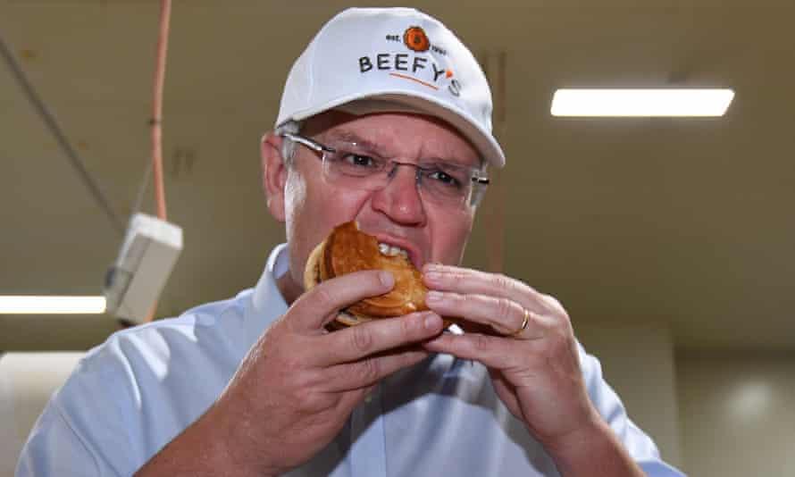 Australian prime minister Scott Morrison eats a pie during a visit to the Beefy’s Pies factory near Maroochydore on the Sunshine Coast during the 2018 election campaign