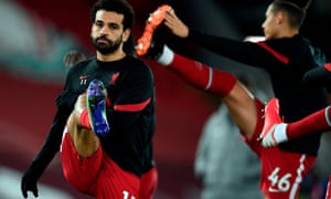 Liverpool’s Mohamed Salah warms up before they play Tottenham.