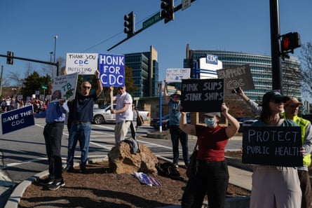 people holding signs