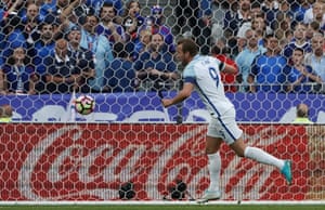 England’s captain Harry Kane celebrates after slotting the first goal away following smart build up play by Ryan Bertrand and Raheem Sterling