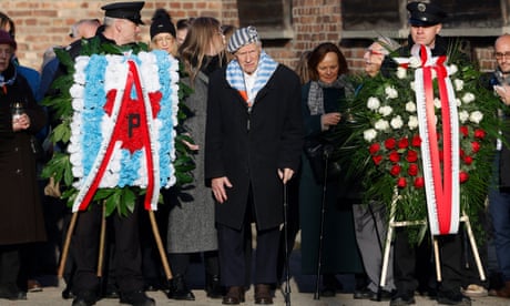 Holocaust survivor Stanislaw Zalewski attends a ceremony as survivors, relatives and representatives of the Memorial and Museum Auschwitz-Birkenau lay wreaths and light candles at the so-called Death Wall next to the former Block 11 of the former Auschwitz I main camp in Oswiecim.