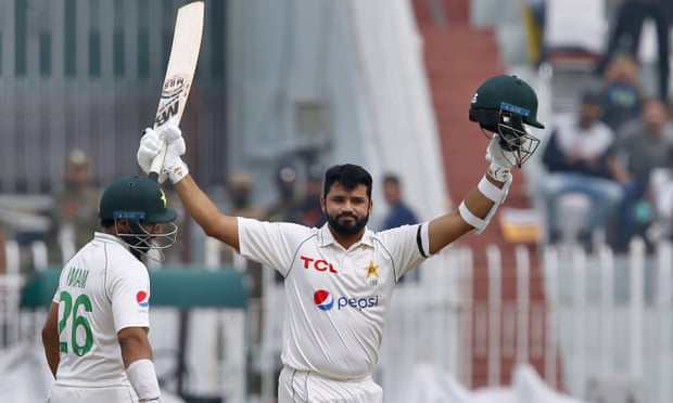 Pakistan's Azhar Ali celebrates after completing his century during the second day