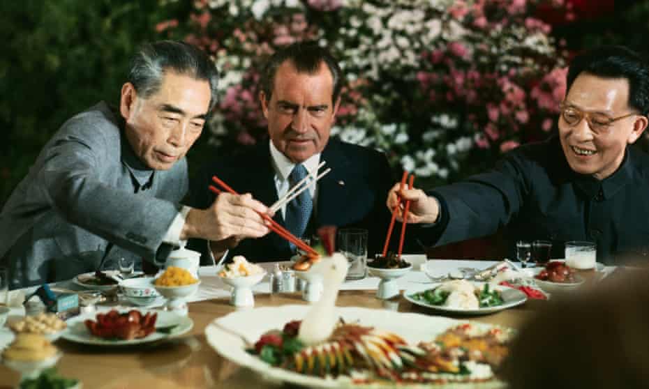 Richard Nixon eating with Zhou Enlai and Chang Chun-chiao in Shanghai.