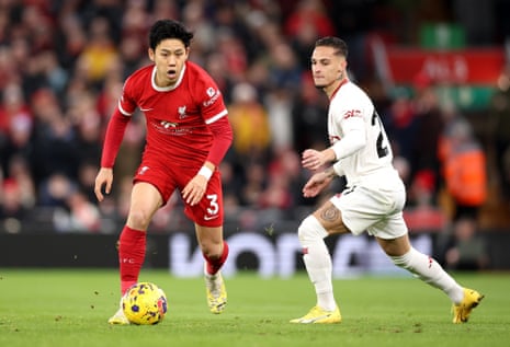 Wataru Endo of Liverpool in action against Antony of Manchester United.