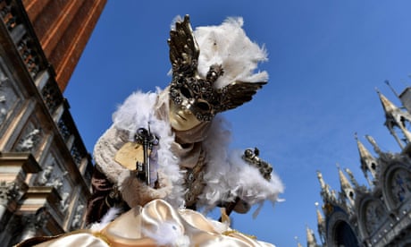 Best photos of the day: Venice carnival and snow horse racing