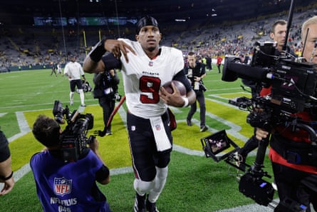 Michael Penix Jr celebrates after leading the Atlanta Falcons to a 35-14 victory over the Green Bay Packers at Lambeau Field.
