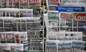 Newspapers are displayed on a stand outside a newsagent on November 28, 2012 in London, England