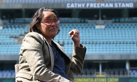 Olympic champion Cathy Freeman with the newly unveiled Cathy Freeman stand at Stadium Australia, in Sydney.