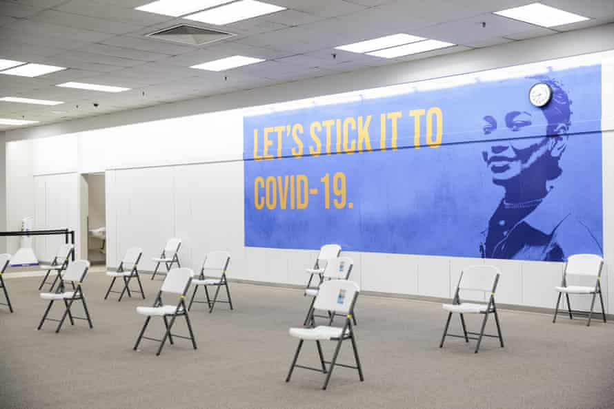 A sign reads “Let’s Stick It To Covid-19” in the observation area of the Townsquare Mall in Rockaway, New Jersey, U.S., on Friday, Jan. 8, 2021.