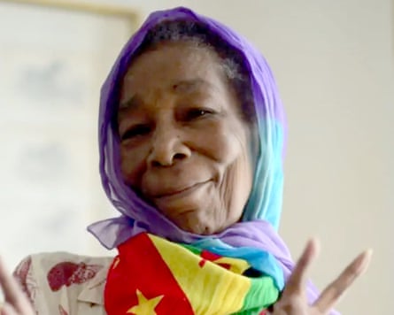 A woman in a colourful headscarf