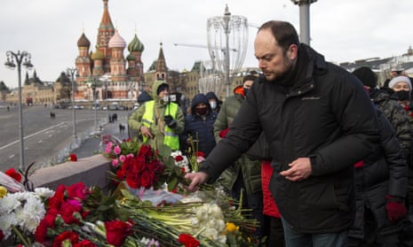 Vladimir Kara-Murza lays flowers last year near the place where Russian opposition leader Boris Nemtsov was gunned down in Moscow in February 2015.