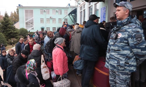 People from Kherson, where Russian forces have been digging in, arriving in Crimea on 21 October.