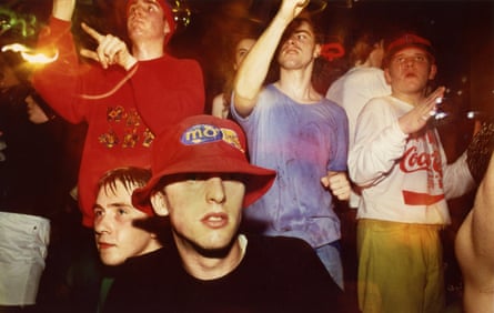 A group of six lads, sweating at a rave