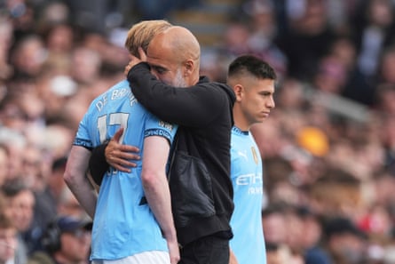 Manchester City’s manager Pep Guardiola hugs Kevin De Bruyne as the Belgian midfielder prepares to come on for his last appearance for Manchester City.