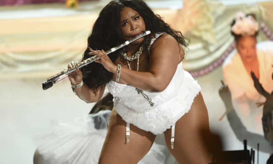 Lizzo plays the flute at the BET Awards in Los Angeles.