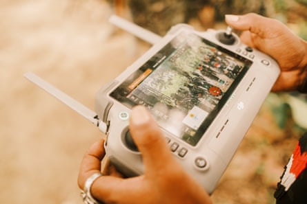 A close of a fighters hands operating a drone remote control