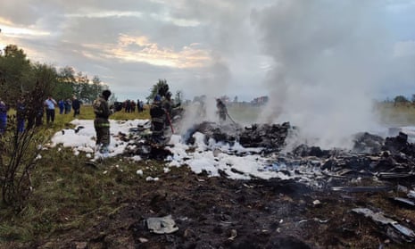 A handout photograph released by Russian Investigative Committee on Wednesday, shows rescuers working at the site of a plane crash near the village of Kuzhenkino, Tver region.