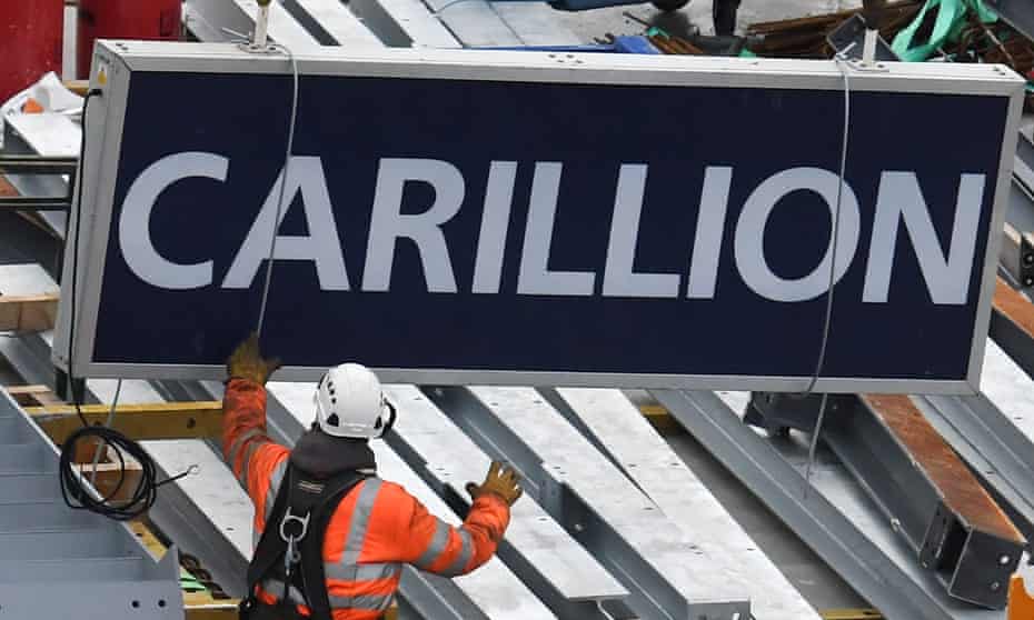A Carillion sign is taken off a construction crane