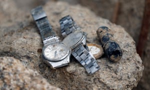 Wristwatches found at the site of a landslide site caused by heavy rain in Kumano, Japan.