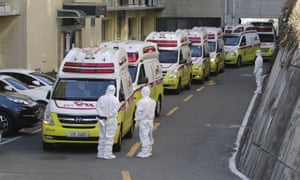 Ambulances carrying patients infected with the novel coronavirus arrive at a hospital in Daegu, South Korea.