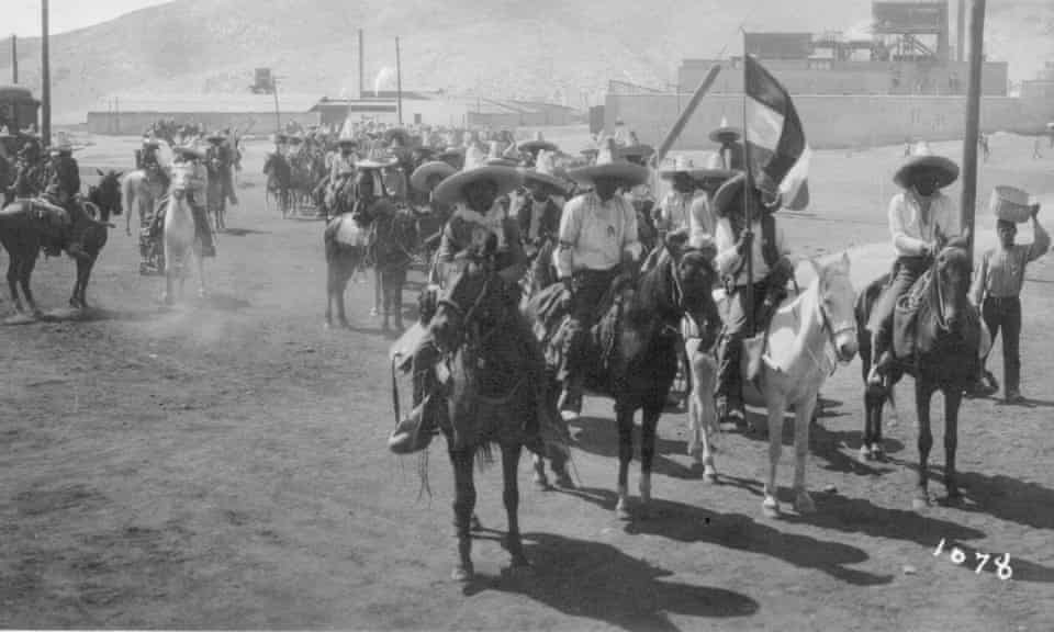 Revolutionary soldiers on horseback in the city of Torreón in 1911.