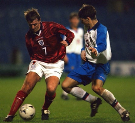 Le Tissier attempts to get the better of Russia’s Vadim Evseev using some fancy footwork.