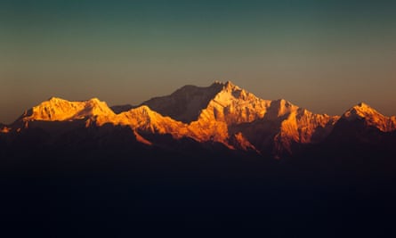 The view of the snow capped peaks of Kangchenjunga, from Tiger Hill in India.