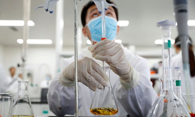 A man works in a laboratory of Chinese firm Sinovac Biotech, which is developing a potential coronavirus vaccine.
