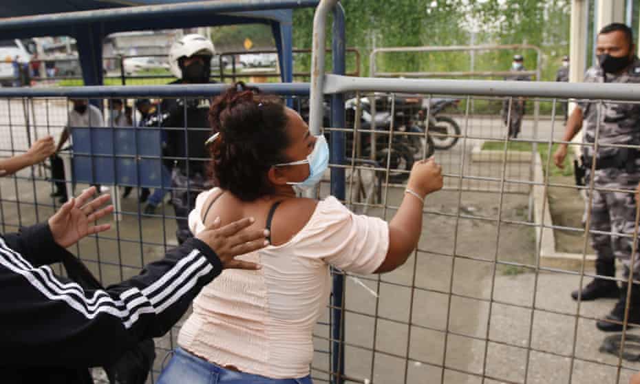 A relative of an inmate outside a prison in Guayaquil on Tuesday. Dozens have died in riots across Ecuador.