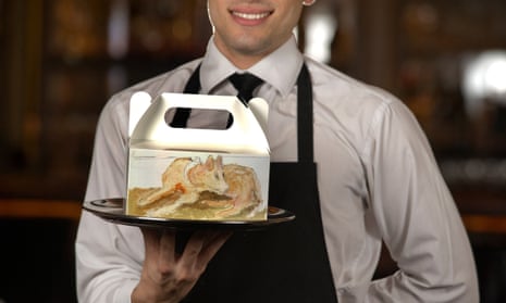 A waiter holding a doggy bag at 34 Mayfair, a restaurant in central London.