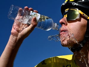 UAE Team Emirates’ Tadej Pogacar, wearing the overall leader’s yellow jersey, cools off after winning the stage.