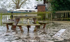 A polluted River Thames floods a picnic area in Datchet, Berkshire, February 2021.