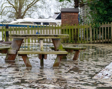 A polluted River Thames floods a picnic area in Datchet, Berkshire, February 2021.