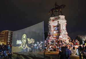 An image of George Floyd is projected on a screen in front of the controversial statue of Confederate General Robert E. Lee in Richmond in July.