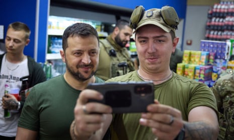President Volodymyr Zelenskiy posing for a selfie with a serviceman during his visit to Donetsk region 